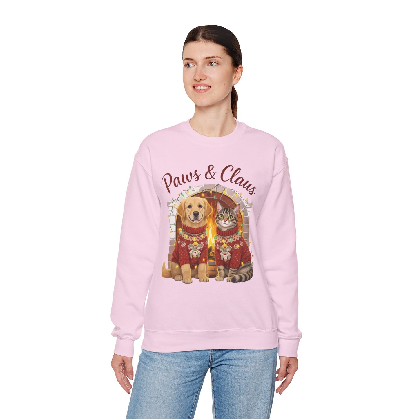 Person wearing a pink sweatshirt with a dog and cat graphic and 'Paws & Claws' text on a white background