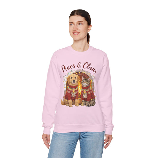 Person wearing a pink sweatshirt with a dog and cat graphic and 'Paws & Claws' text on a white background