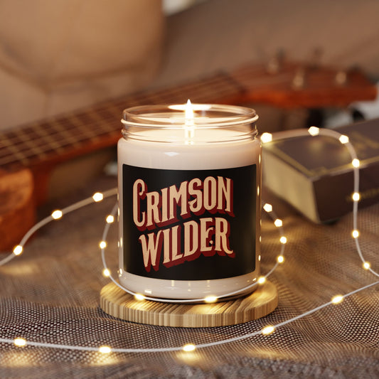 Candle in a jar labeled 'Crimson Wilder' with a guitar and string lights in the background