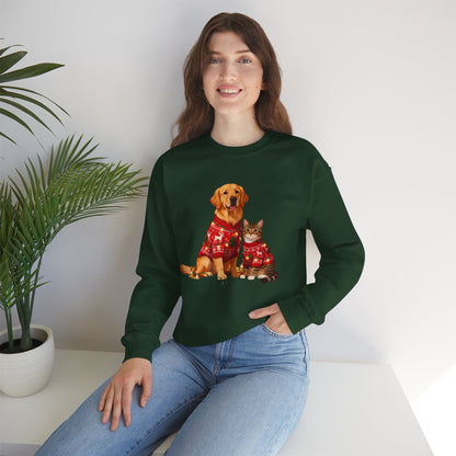 Woman wearing a green sweatshirt with a dog and cat design, sitting on a white surface with a plant in the background.